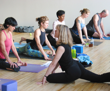 Jenny Otto teaching pigeon pose