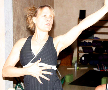 Jenny Otto teaching a shoulder stretch