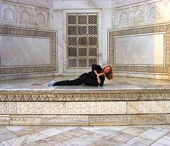 Jenny Otto in India at the Taj Mahal in Pigeon Twist Pose