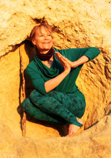 Jenny Otto Malasana Twist Namaste on a rock